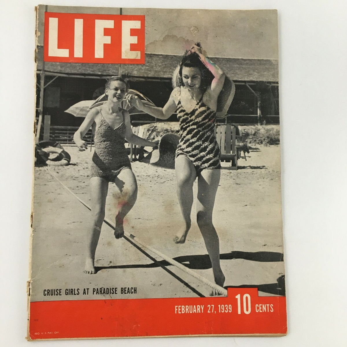 Cover of VTG Life Magazine from February 27, 1939, featuring 'Cruise Girls at Paradise Beach,' depicting two girls in swimsuits joyfully running along the beach.