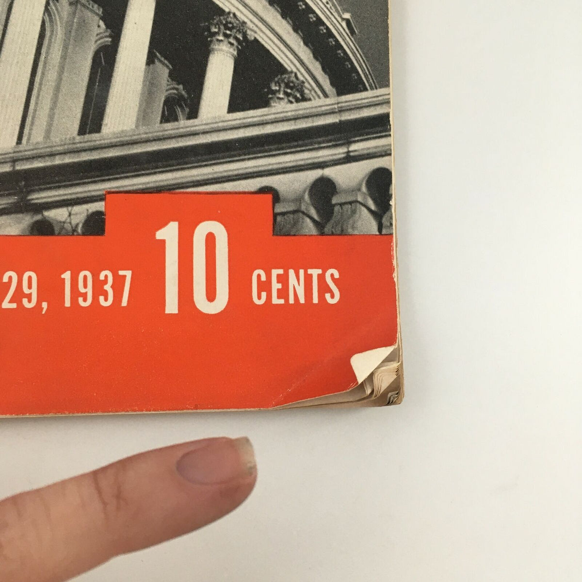 Close-up view of the corner of VTG Life Magazine from November 29, 1937, featuring a price tag of 10 cents, showcasing the vintage aesthetic and condition of the magazine.