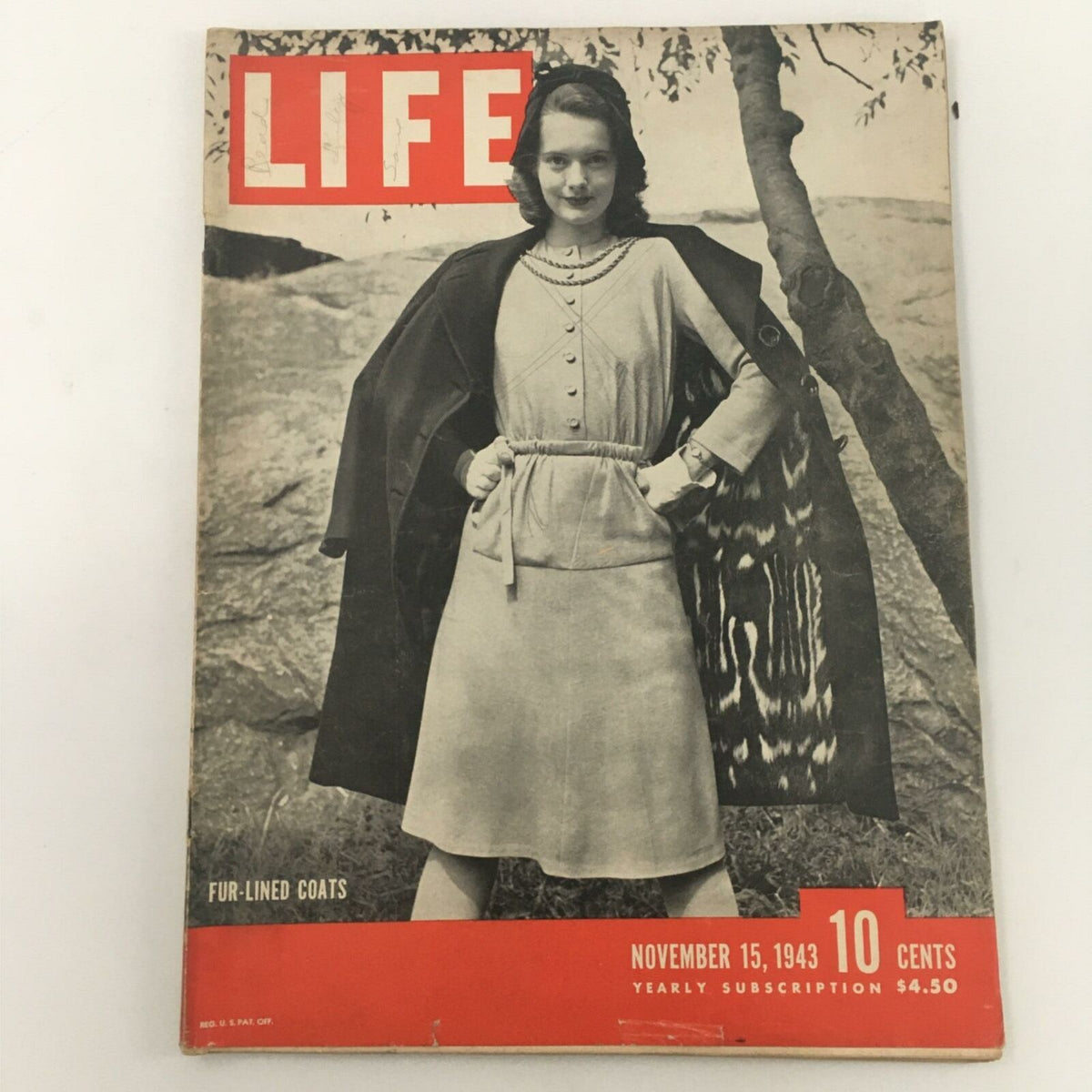 VTG Life Magazine November 15, 1943 featuring a woman in a fur-lined coat standing outdoors, showcasing vintage fashion.