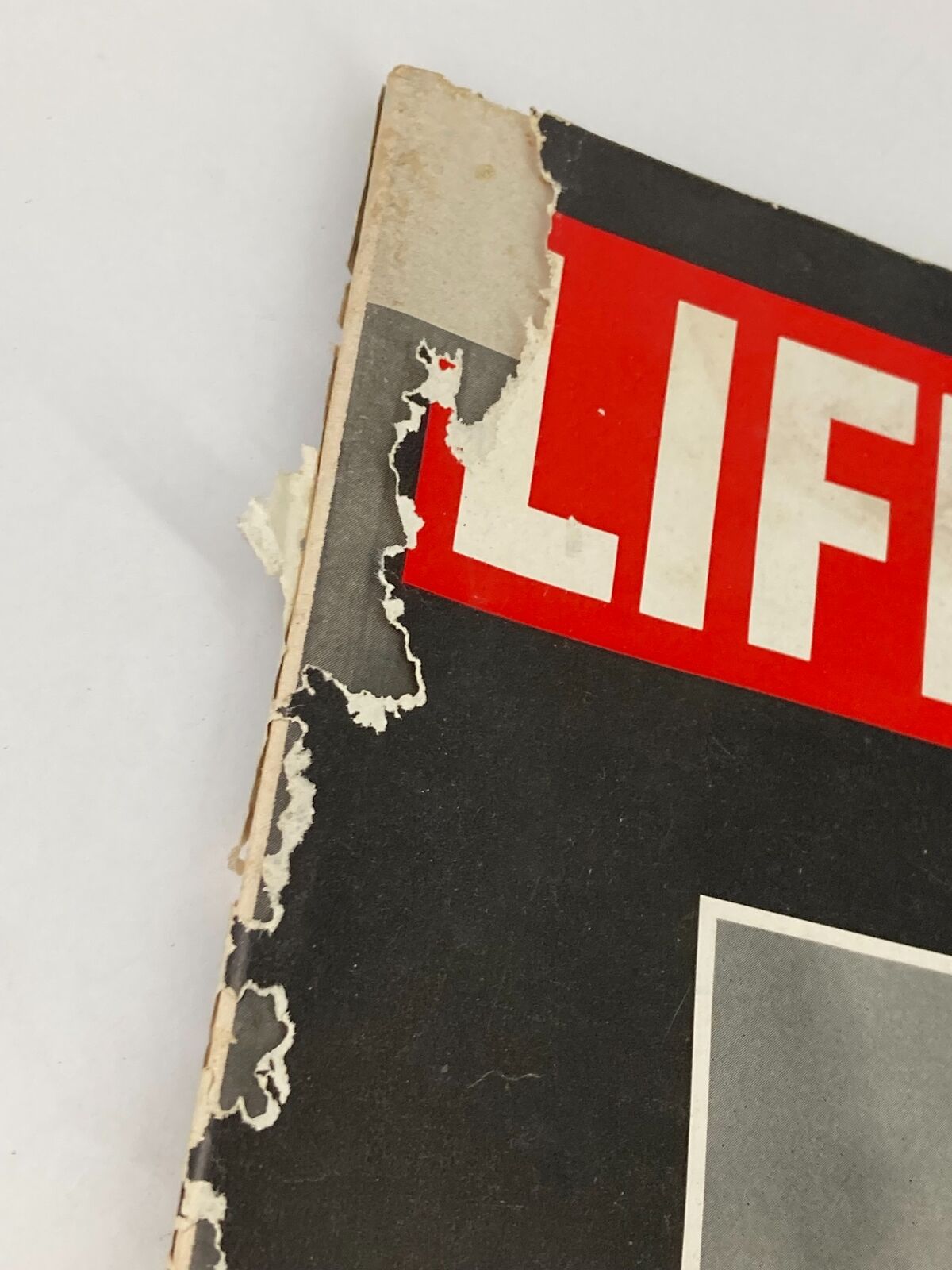 Side view of the cover of VTG Life Magazine April 12 1968 showing wear and tear, highlighting the vintage condition of the magazine.