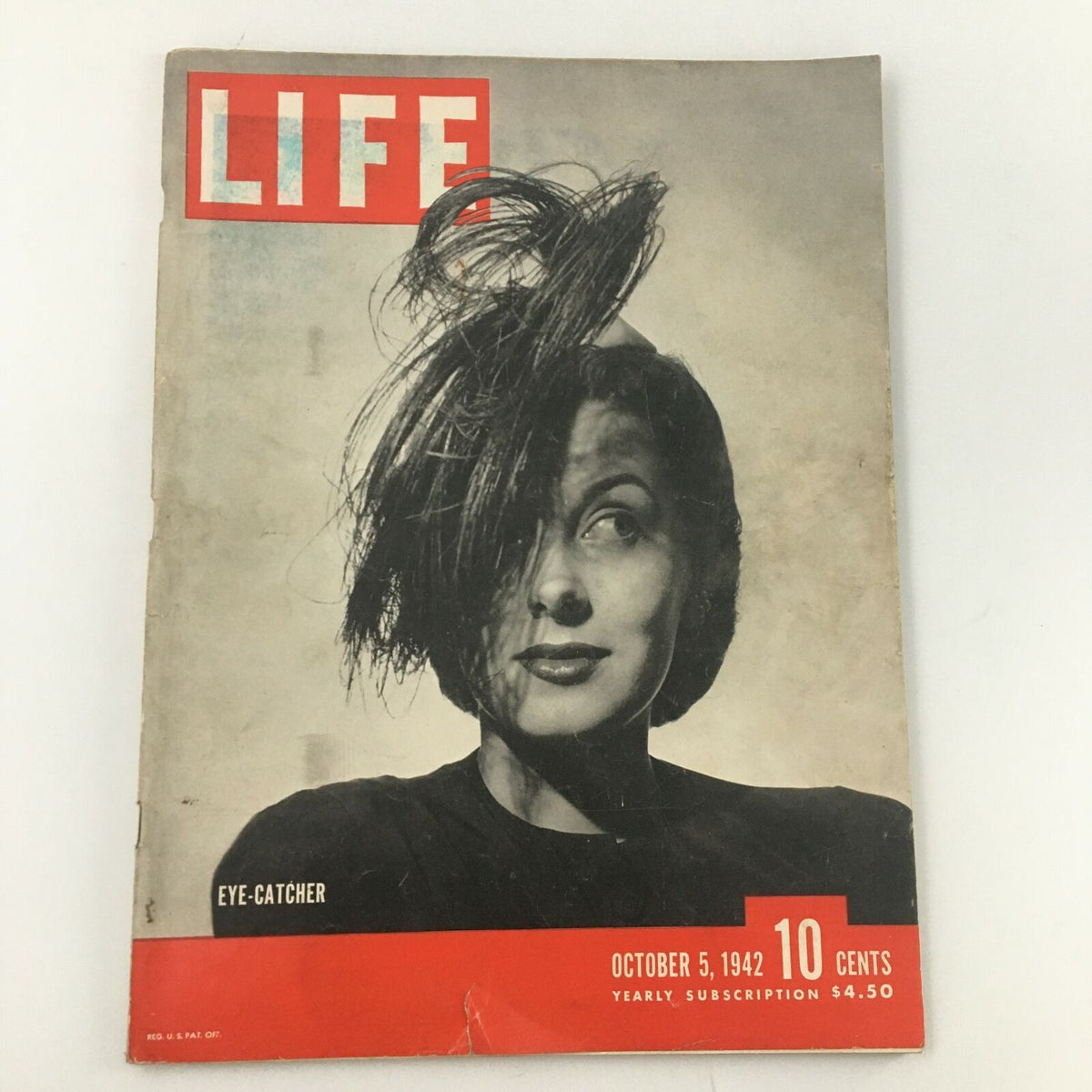 Cover of VTG Life Magazine October 5, 1942, featuring 'Eye-Catcher Hats' with a striking image of a woman showcasing an elegant hairstyle.