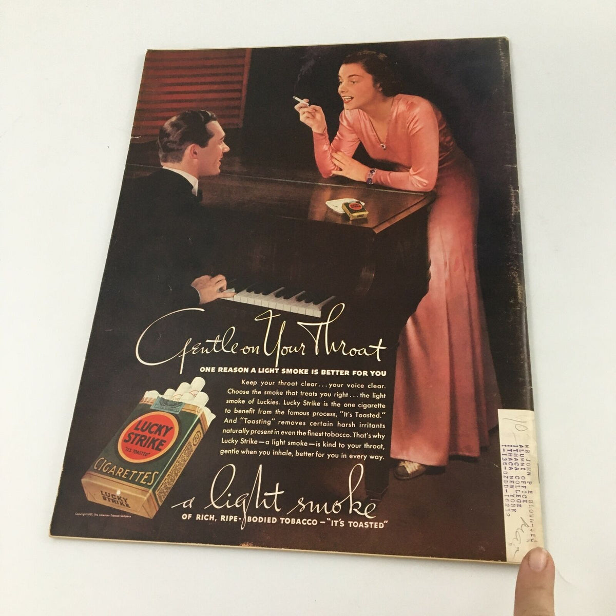 Back cover of VTG Life Magazine February 8 1937, showcasing an advertisement for Lucky Strike cigarettes with a visually striking illustration of a woman and a man at a piano.