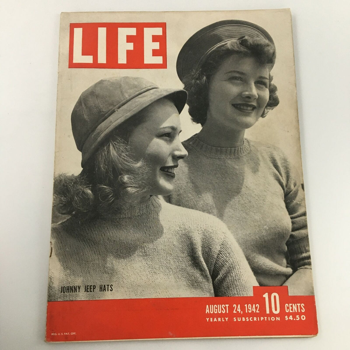 Cover of the VTG Life Magazine from August 24, 1942, featuring the title 'Johnny Jeep Hats'. The magazine displays two women in stylish hats, embodying fashion from the era. This vintage publication is ideal for collectors and history enthusiasts, highlighting wartime fashion trends.