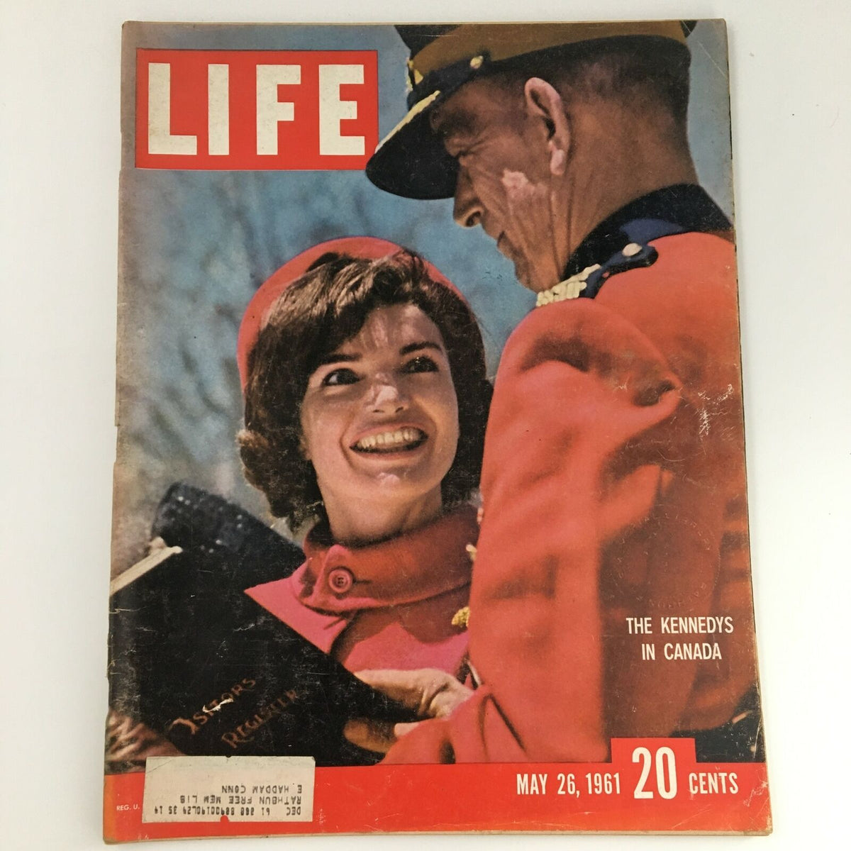 Cover of VTG Life Magazine from May 26, 1961 featuring Jacqueline Kennedy smiling while engaged with a Royal Canadian Mounted Policeman, encapsulating her visit to Canada.