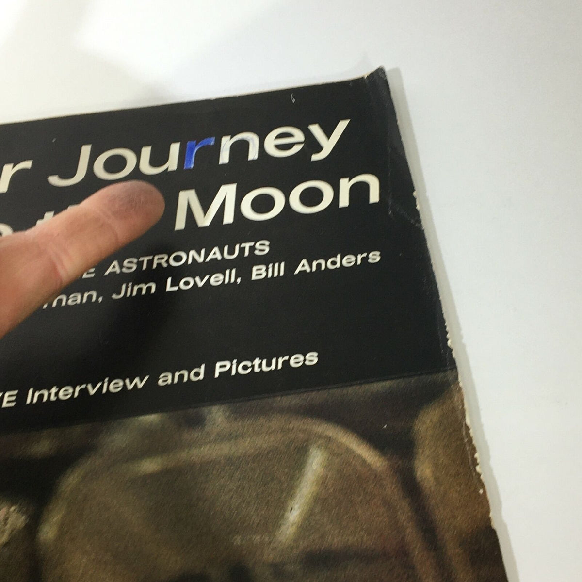 Close-up of the VTG Life Magazine January 17 1969 cover highlighting the title 'Our Journey to the Moon' with a finger pointing to the text.