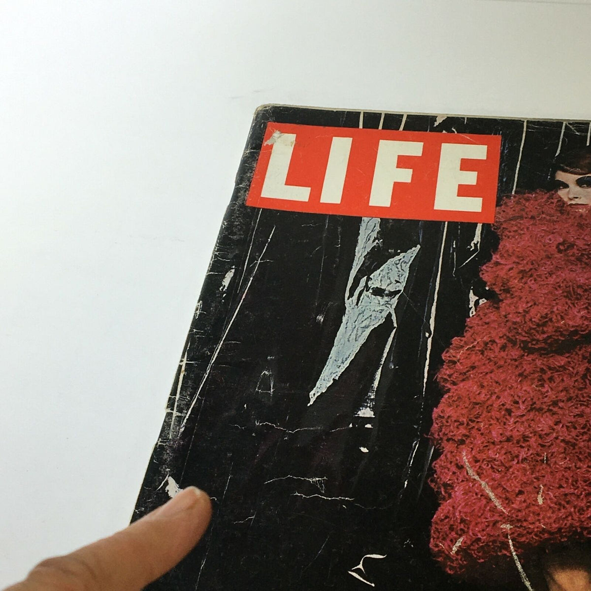 Side view of VTG Life Magazine from September 26, 1960, revealing the prominent 'LIFE' logo and the vintage magazine's worn texture.