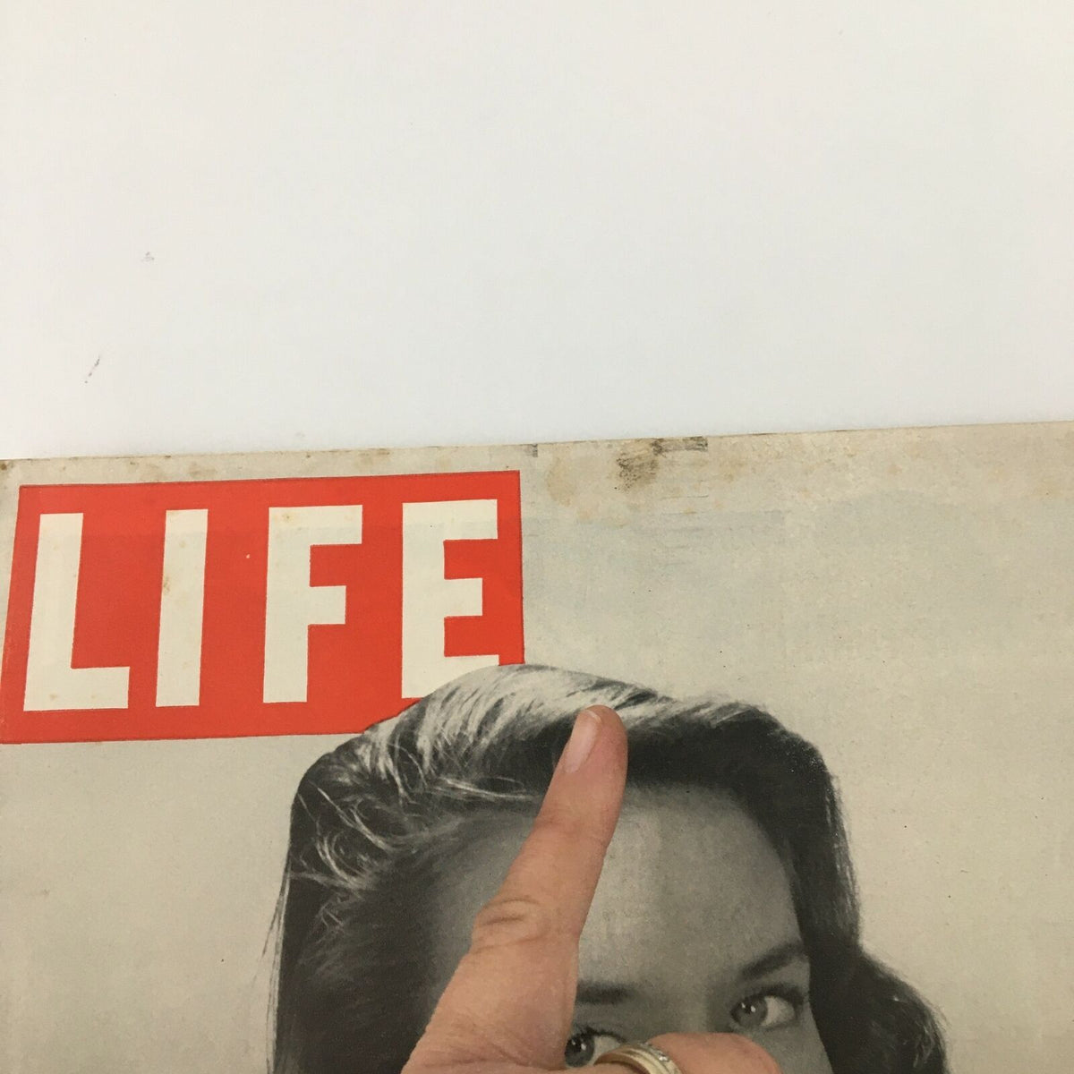 Close-up of the VTG Life Magazine October 15 1945 cover, highlighting the iconic red LIFE logo and a glimpse of the woman in jewelry.