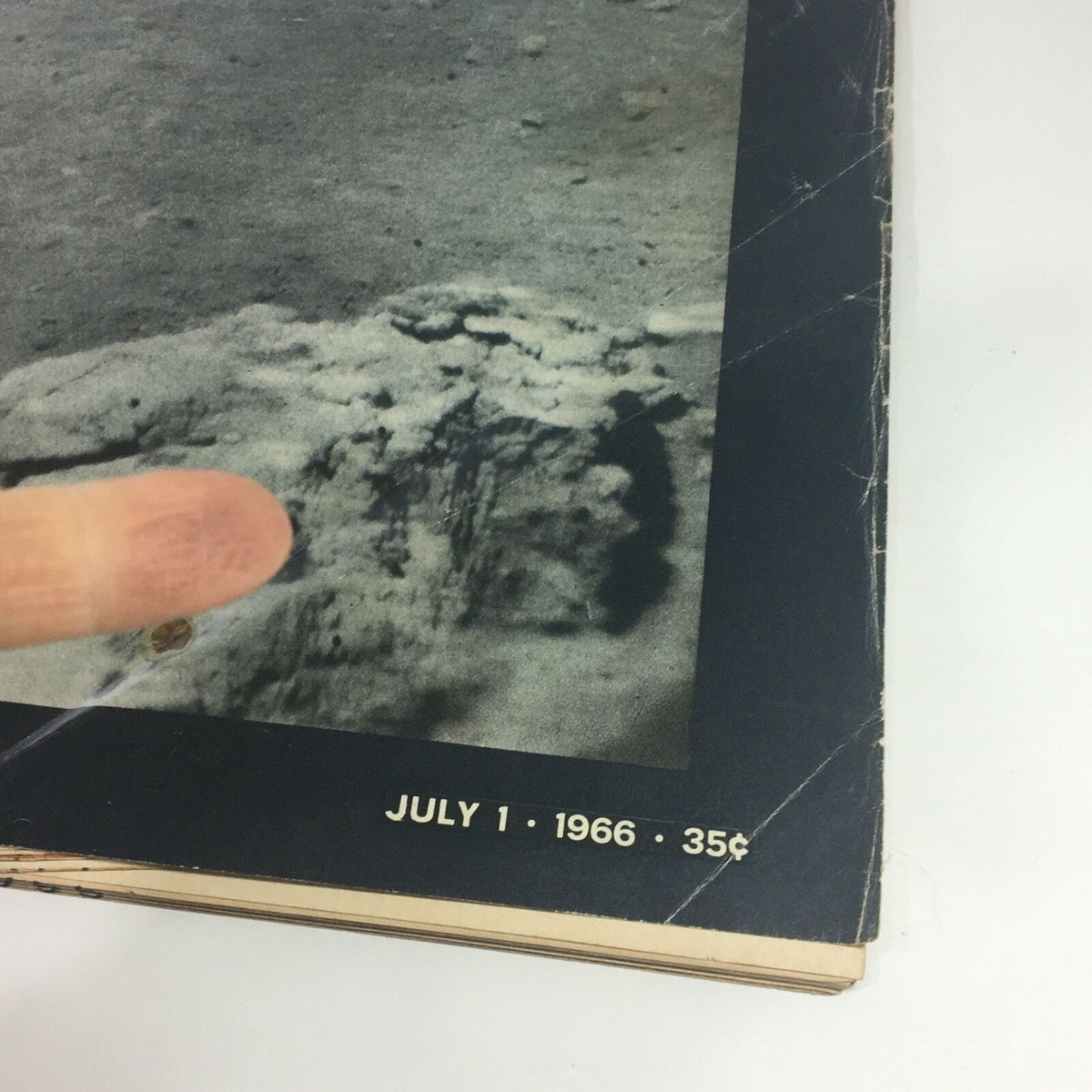 Close-up of the cover of VTG Life Magazine July 1, 1966, illustrating details of the lunar landscape and the magazine's title 'The True Color of the Moon'.