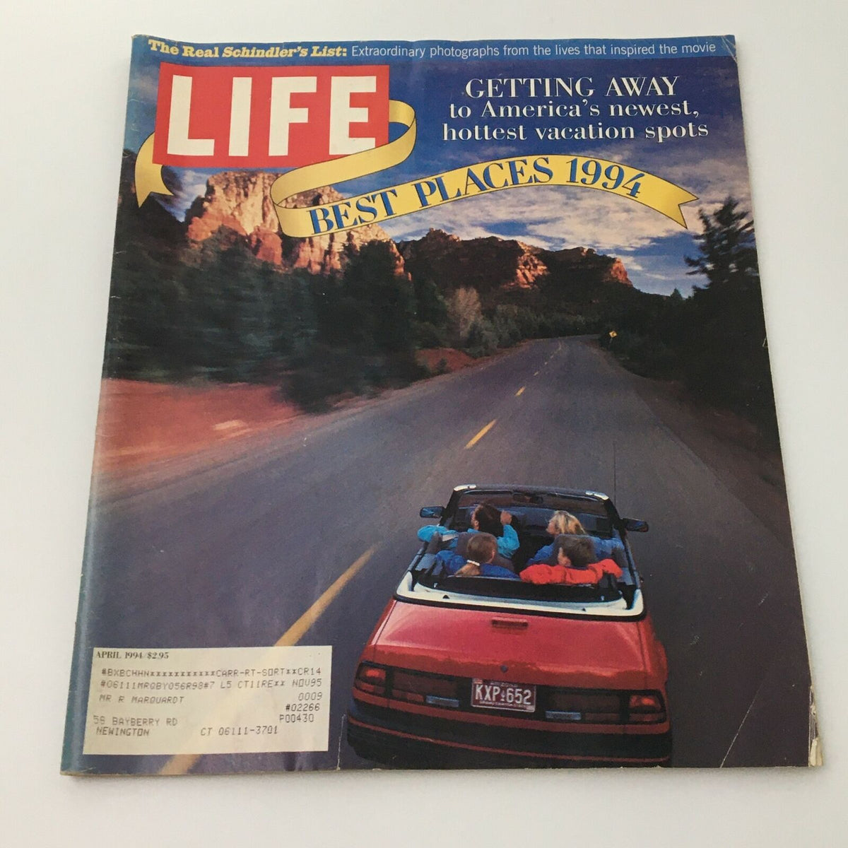 Cover of Life Magazine April 1994 featuring 'The Real Schindler's List' and 'Best Places 1994' with a scenic road and a convertible car.