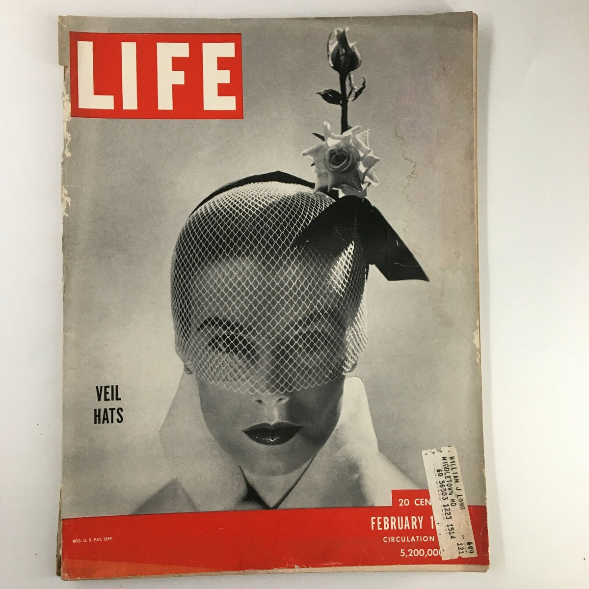 Cover of VTG Life Magazine February 12 1951 featuring a model wearing a veil hat against a black and white backdrop, highlighting atomic tests lighting up four states.