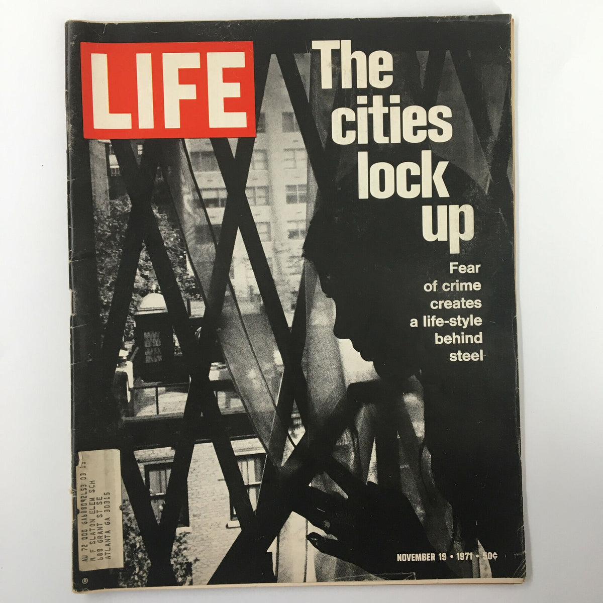 Cover of VTG Life Magazine from November 19, 1971, featuring the headline 'The Cities Lock Up' which discusses the impact of crime on urban living behind steel structures.