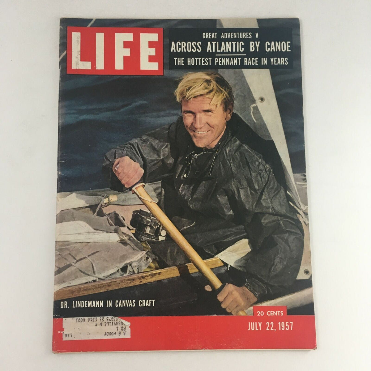 Cover of Life Magazine from July 22, 1957 featuring Dr. Lindemann in a canvas craft, showcasing his adventure of crossing the Atlantic by canoe. Includes vibrant imagery and text highlighting the excitement of exploration.