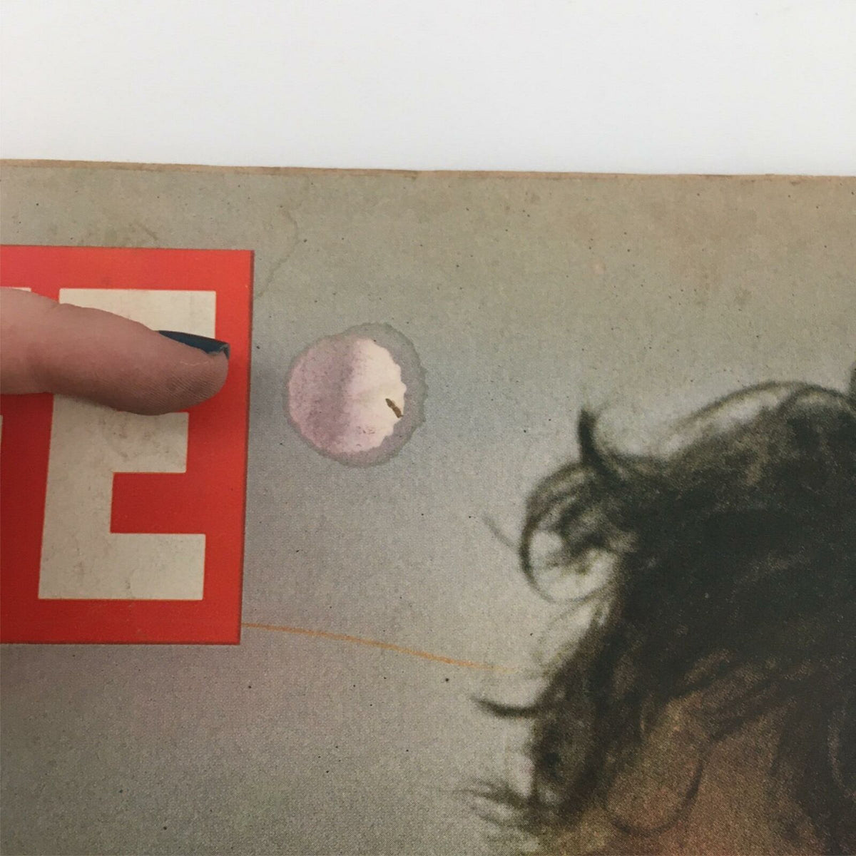 Top corner detail of the VTG Life Magazine June 20, 1969, showing wear with the 'LIFE' logo and minor staining on the cover.