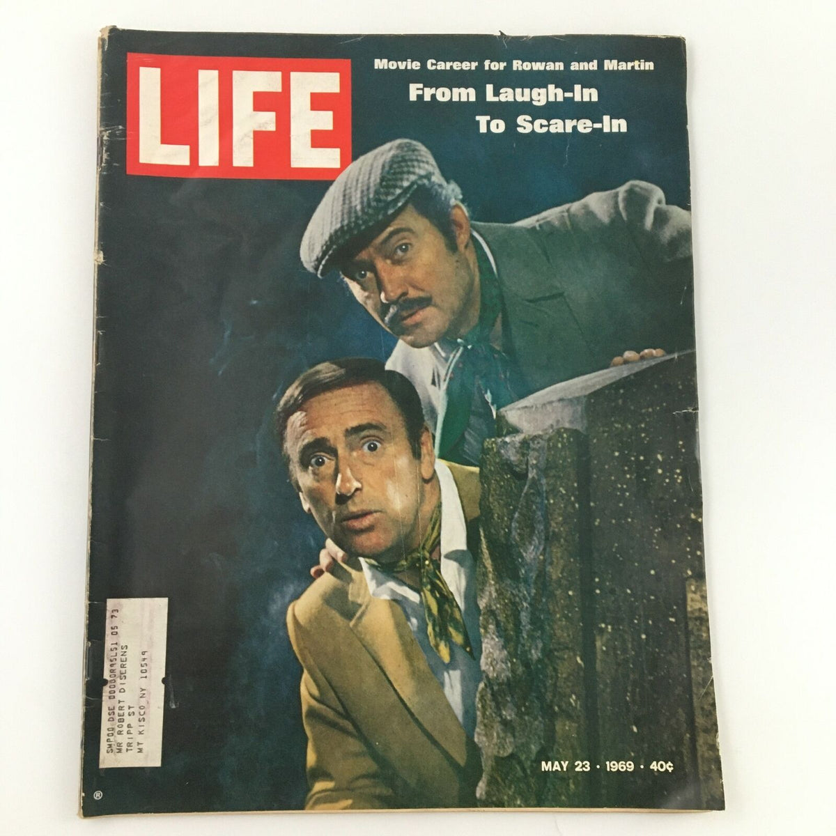 Vintage Life Magazine cover from May 23, 1969, featuring Dan Rowan and Dick Martin from Laugh-In, titled 'From Laugh-In To Scare-In'. The cover shows the comedic duo with a backdrop, showcasing the essence of 1960s comedy.