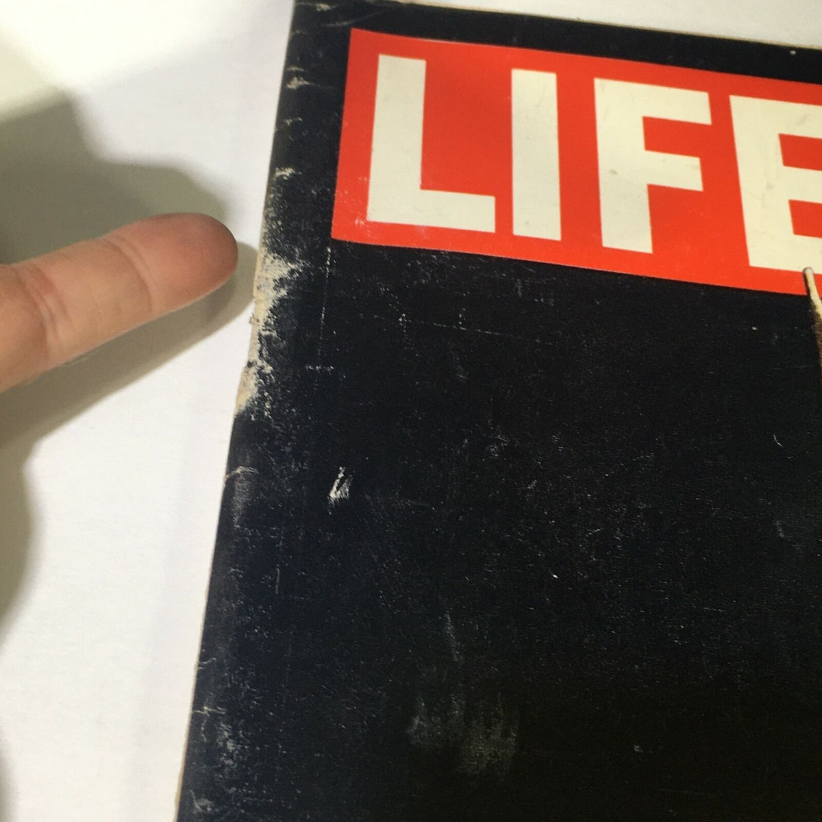 Close-up of the vintage Life Magazine June 7, 1963 cover showing wear and tear, highlighting the edges and spine condition.