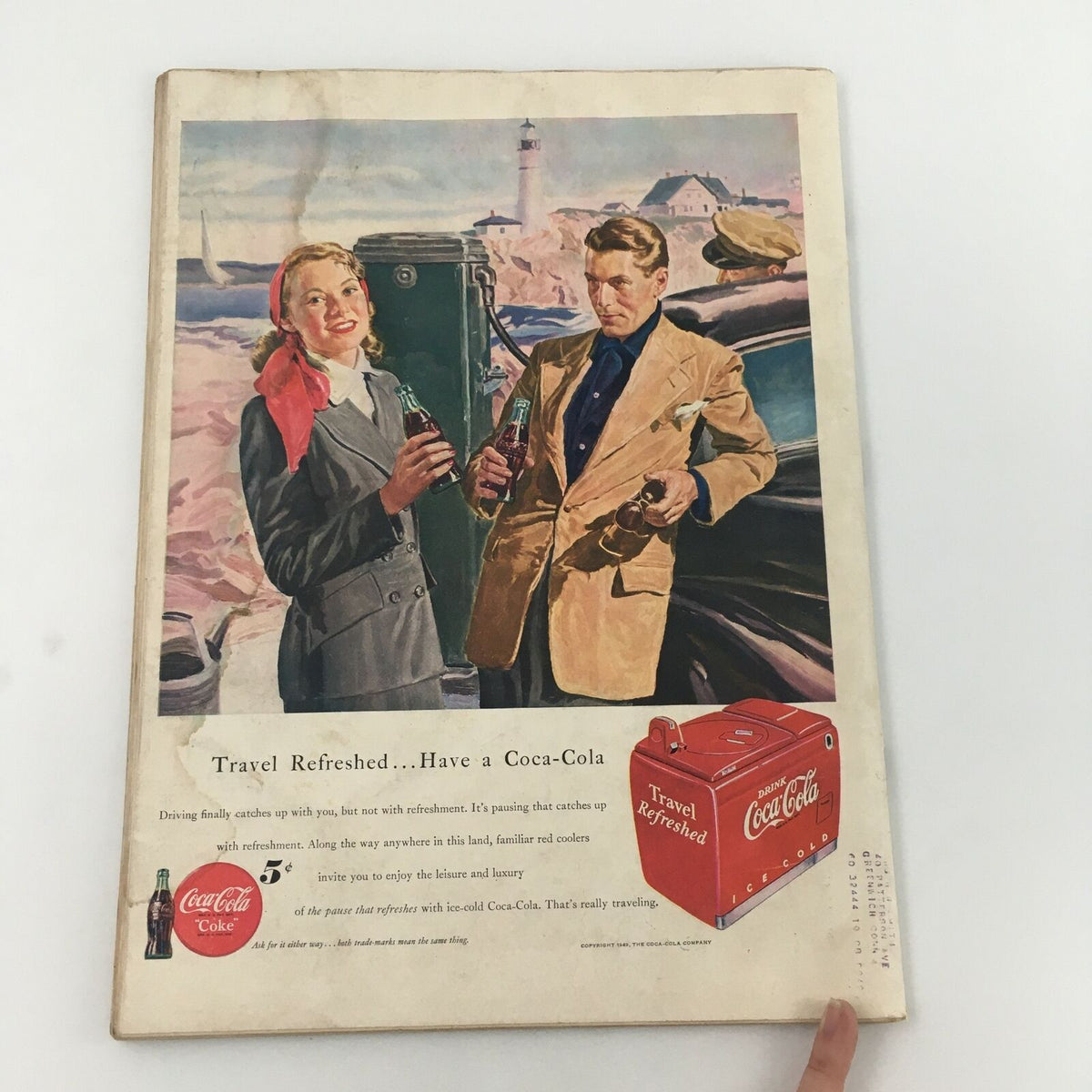 Back cover of VTG Life Magazine May 2, 1949, displaying a vintage Coca-Cola advertisement with a couple enjoying refreshments by the ocean.
