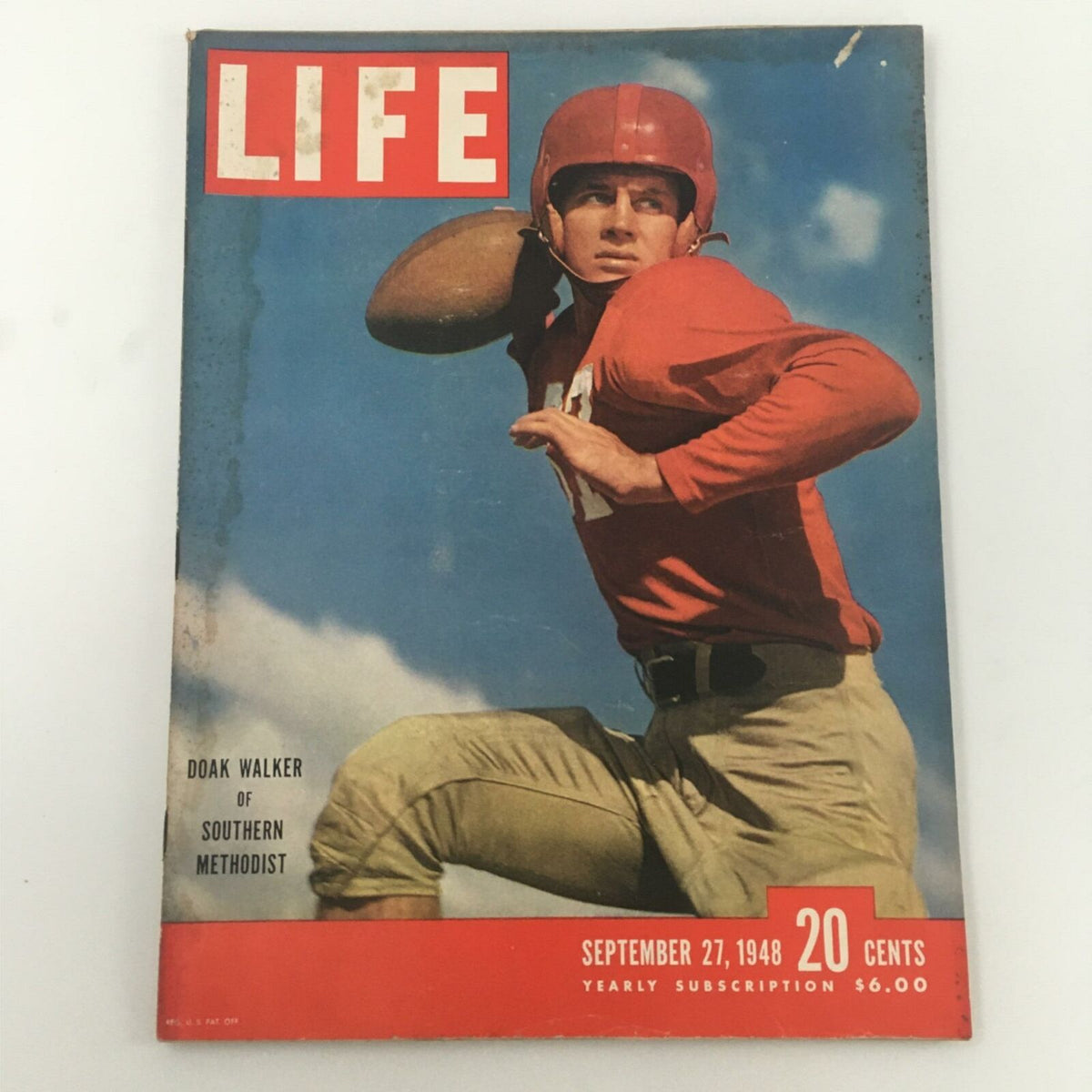 Cover of VTG Life Magazine dated September 27, 1948, featuring Doak Walker of Southern Methodist University in a red football jersey, poised to throw a football against a blue sky backdrop.
