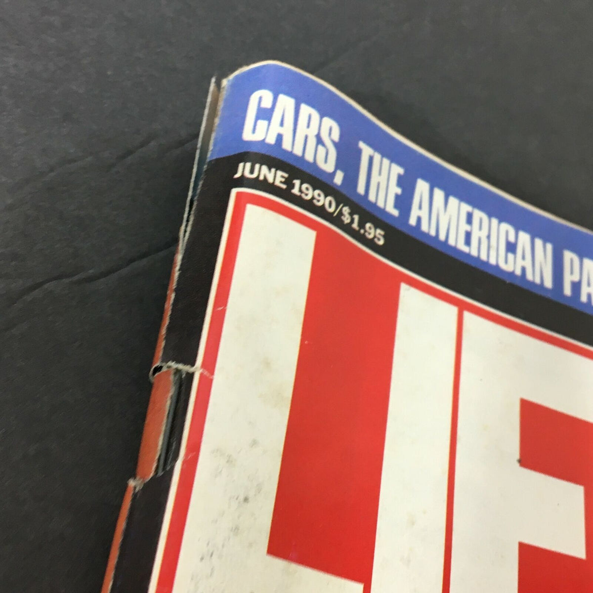 Close-up view of the corner of Life Magazine, June 1990 edition, featuring the title and price. This issue commemorates thirteen years after the death of Elvis Presley, making it a collectible vintage magazine.