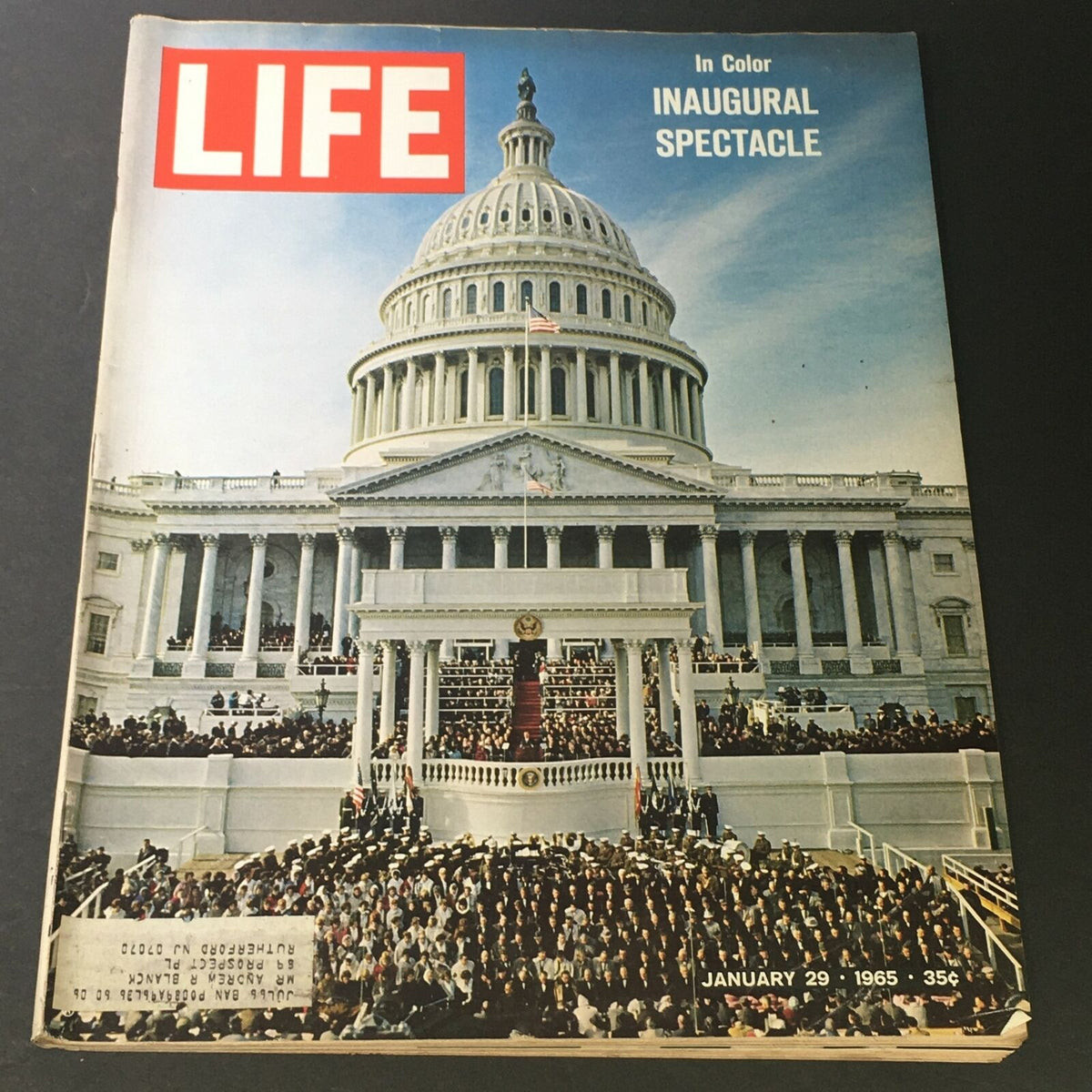 Cover of VTG Life Magazine January 29 1965 featuring the Inaugural Spectacle, showcasing a large gathering of people outside the Capitol building with vibrant colors and historical significance.