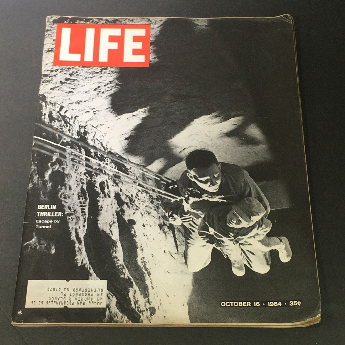 Cover of VTG Life Magazine from October 16, 1964 featuring the story 'Berlin Thriller's Escape by Tunnel', showcasing a dramatic black and white image related to the Cold War escape.