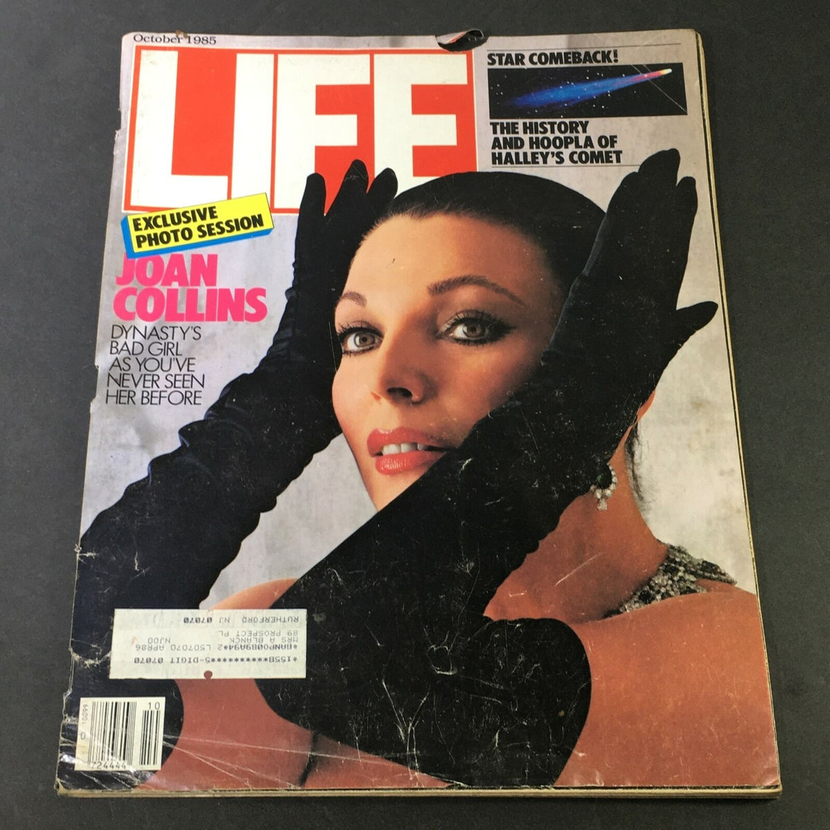 Cover of VTG Life Magazine October 1985 featuring Joan Collins, star of 'Dynasty,' in glamorous gloves, highlighting 'The History and Hoopla of Halley's Comet.'