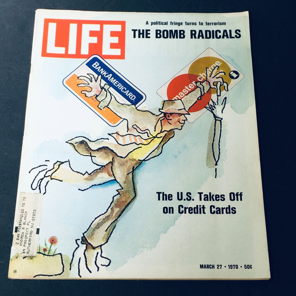 VTG Life Magazine March 27 1970 cover featuring a political commentary titled 'A Political Fringe Turns To Terrorism', illustrated with an image of a man interacting with credit cards, highlighting the theme 'The U.S. Takes Off on Credit Cards', showcasing vintage design and historical context.