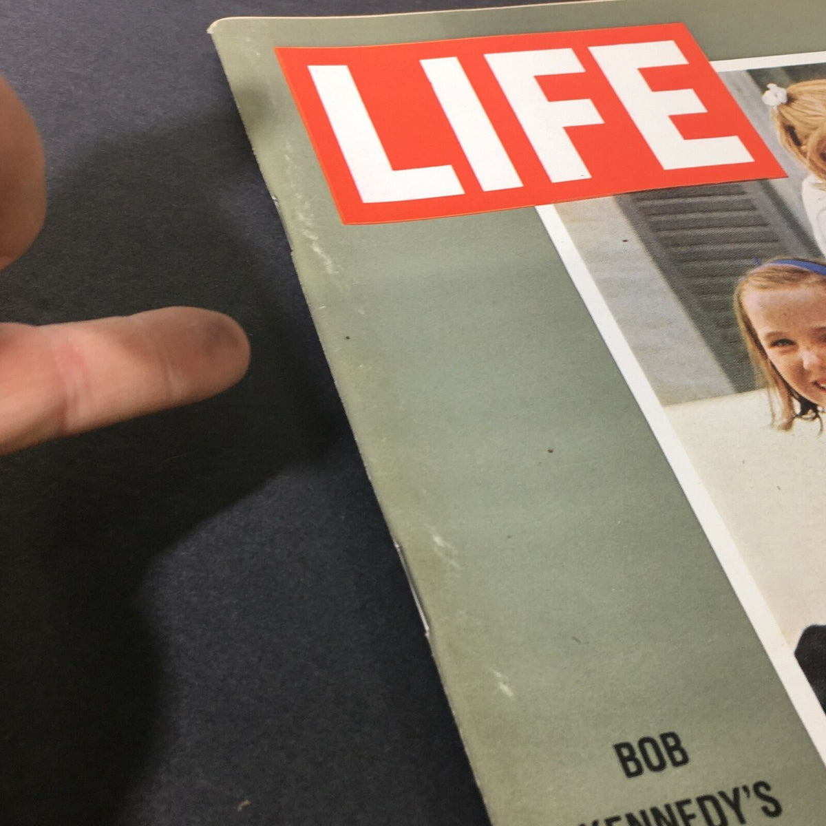 Close-up of the edge of the VTG Life Magazine July 3 1964, showing minor wear and displaying the title 'Bob Kennedy's Week of Trial and Decision'.