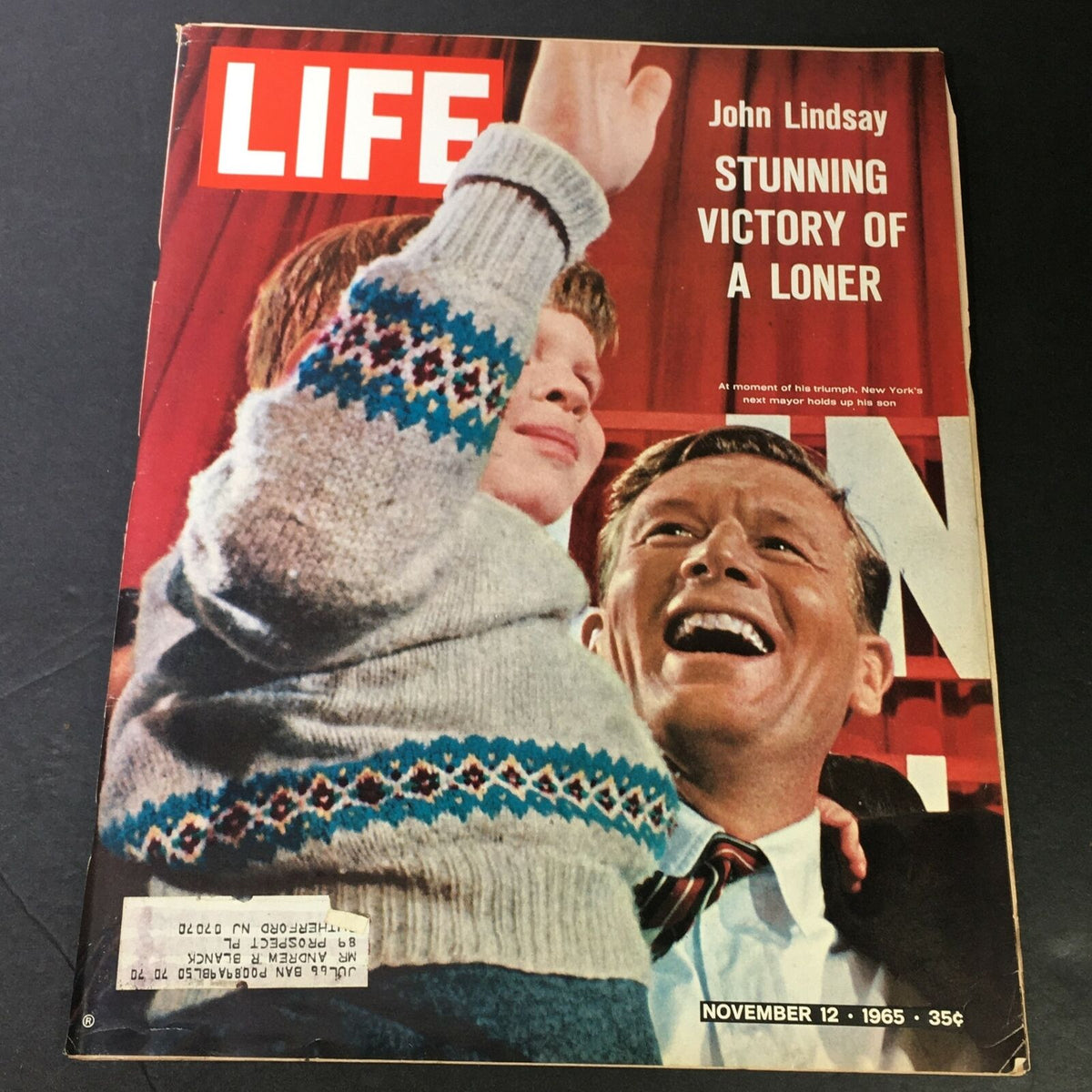 Cover of VTG Life Magazine from November 12, 1965, featuring John Lindsay and a child celebrating, titled 'STUNNING VICTORY OF A LONER'.