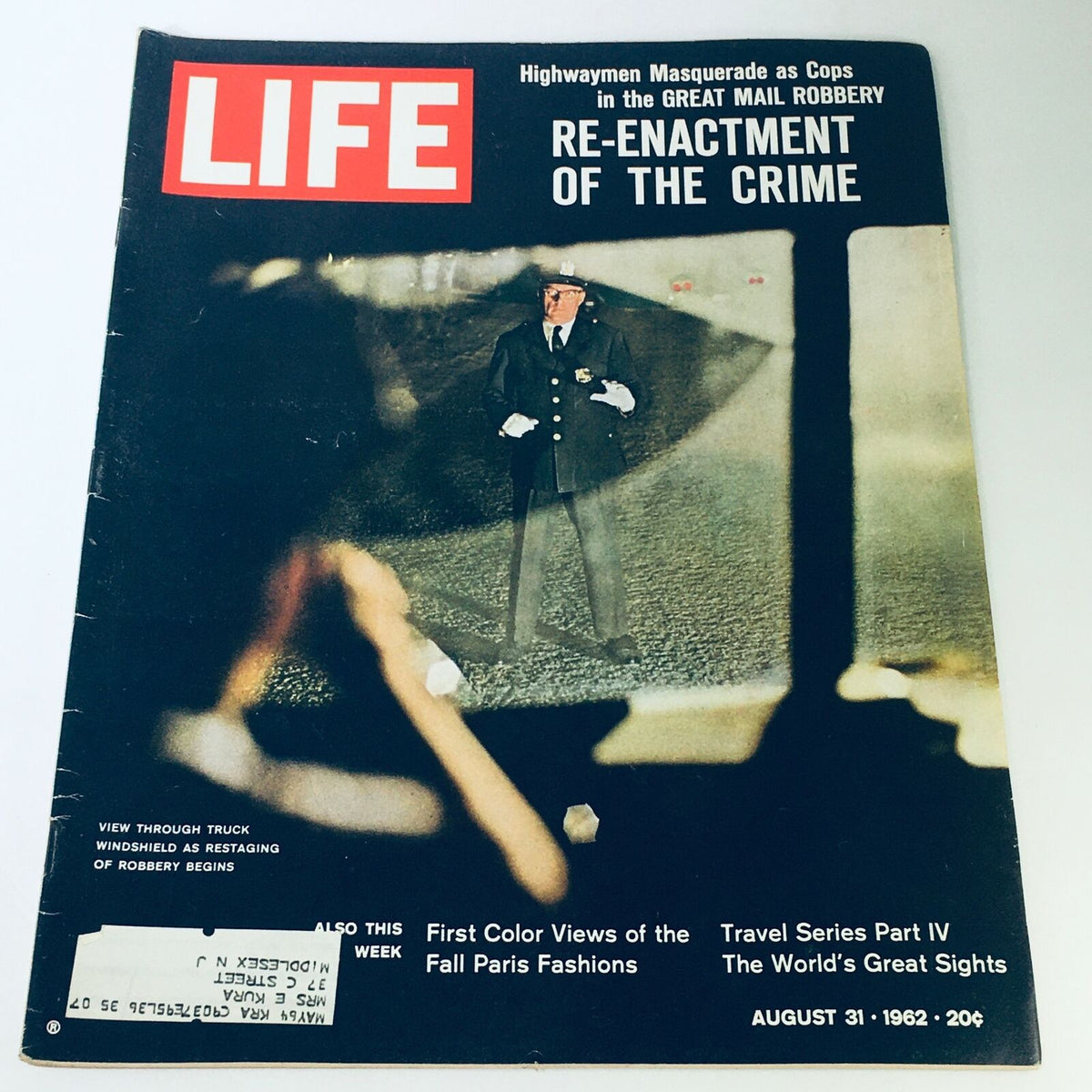 Cover of VTG Life Magazine August 31 1962 featuring an article titled 'Highwaymen Masquerade as Cops in the Great Mail Robbery' with a reenactment of the crime and visuals of a police officer.