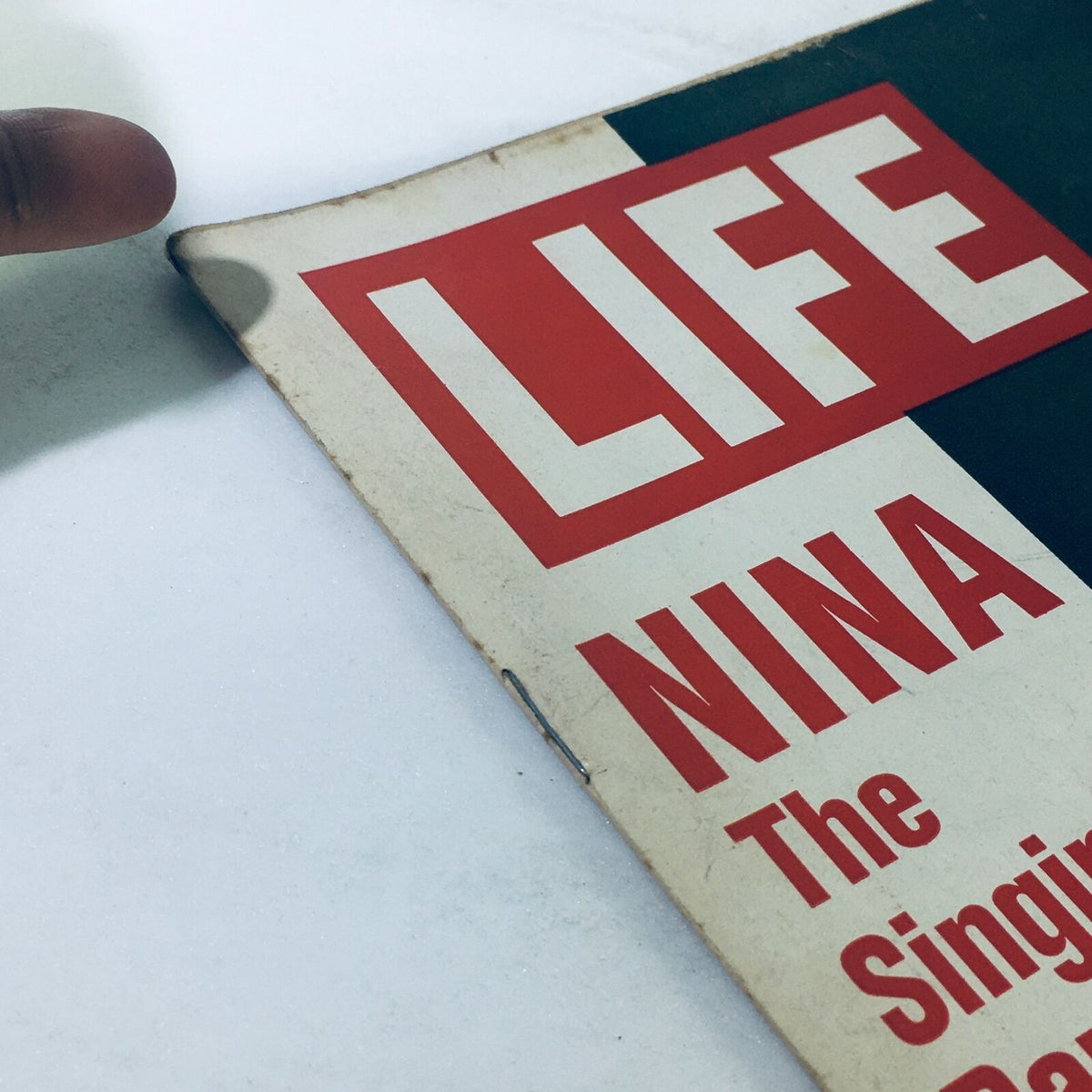 Close-up of the edge of VTG Life Magazine cover featuring Nina van Pallandt, dated February 11, 1972, showcasing slight wear consistent with its vintage condition.