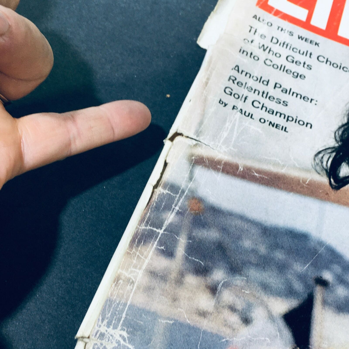 Side view showing a close-up of the cover of VTG Life Magazine June 15, 1962 with visible wear and tear.