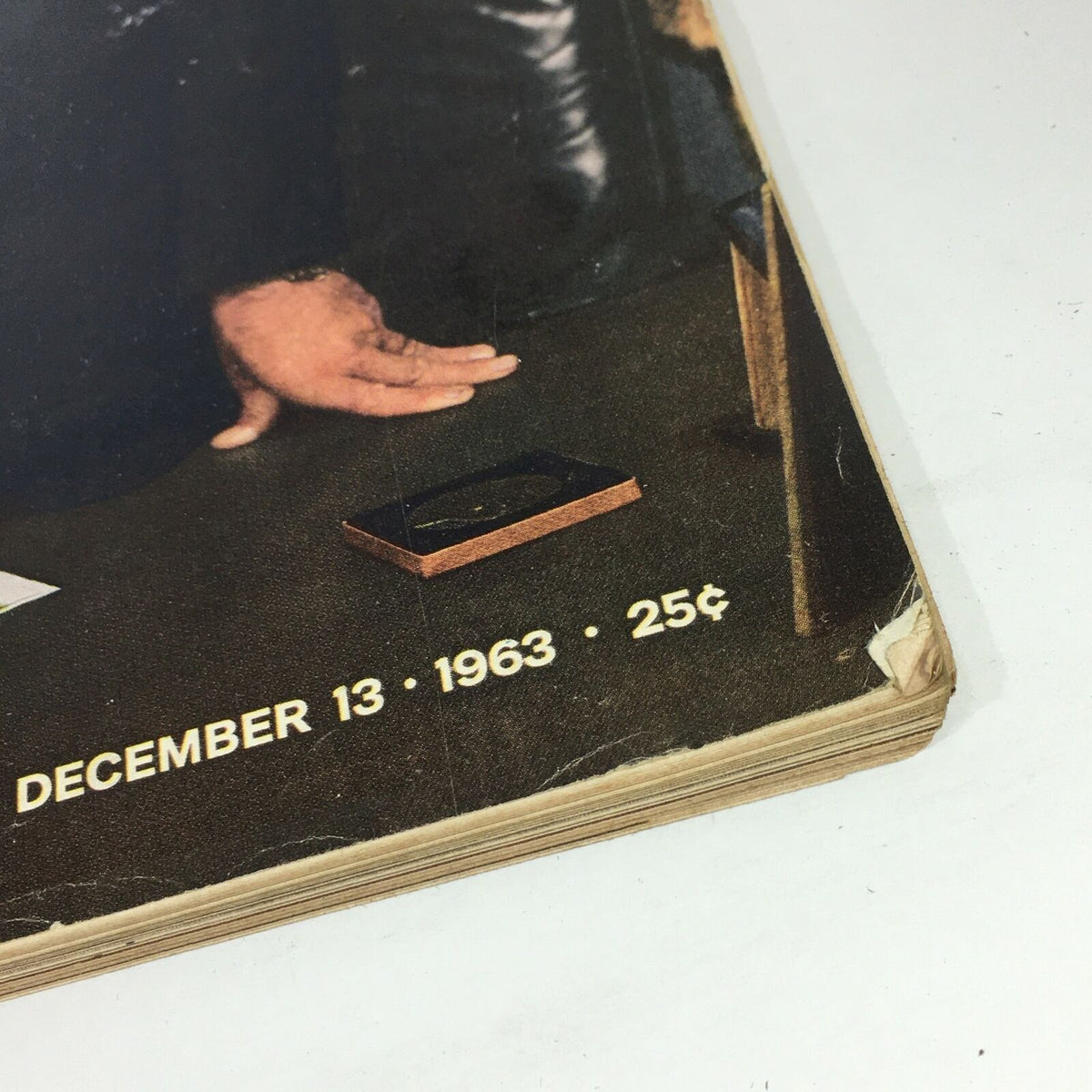 Close-up of the December 13, 1963, issue of VTG Life Magazine, featuring a photo of President Lyndon B. Johnson at his White House desk, highlighting the publication date and a glimpse of its vintage condition.
