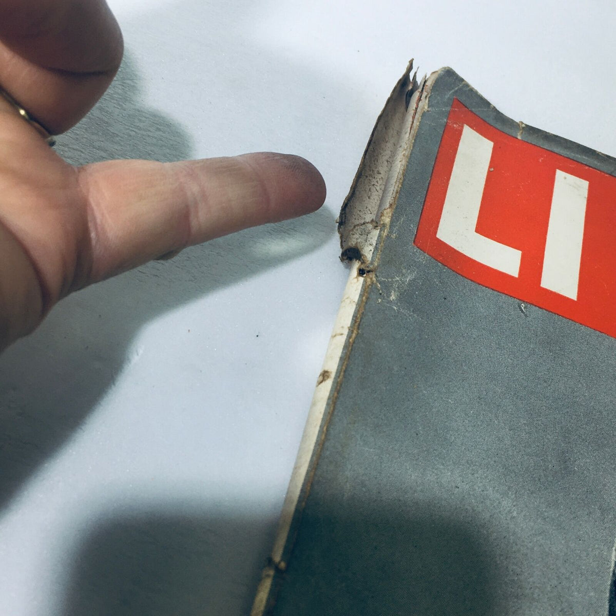 Side view of the damaged spine of VTG Life Magazine March 8 1948, indicating age and usage.