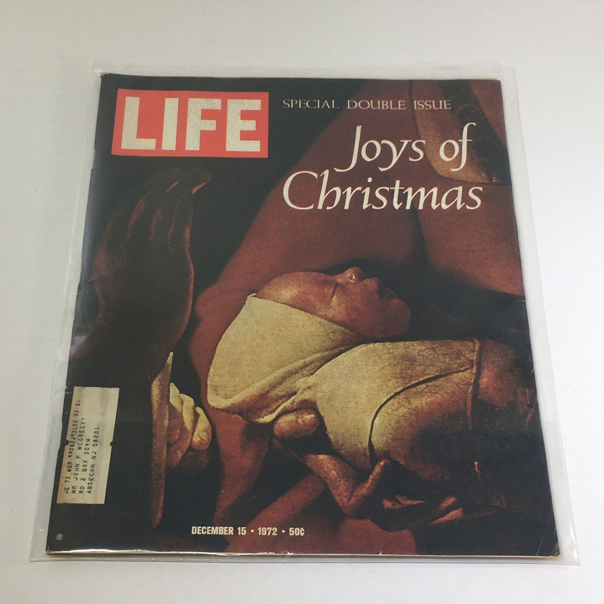 VTG Life Magazine cover from December 15, 1972 - Special Double Issue: Joys of Christmas featuring a poignant image of a newborn and hands, representing love and warmth during the holiday season.