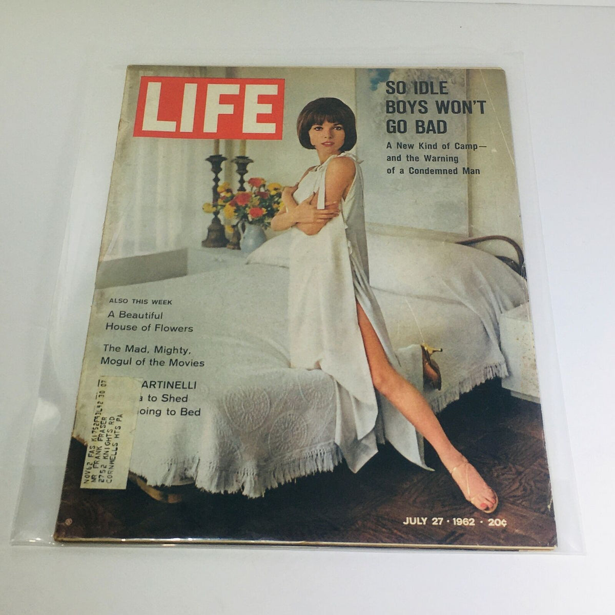 VTG Life Magazine from July 27, 1962 featuring the cover story 'The Mad, Mighty, Mogul of the Movies' with a vintage design showcasing a model in a stylish outfit against a backdrop of flowers and a bed.