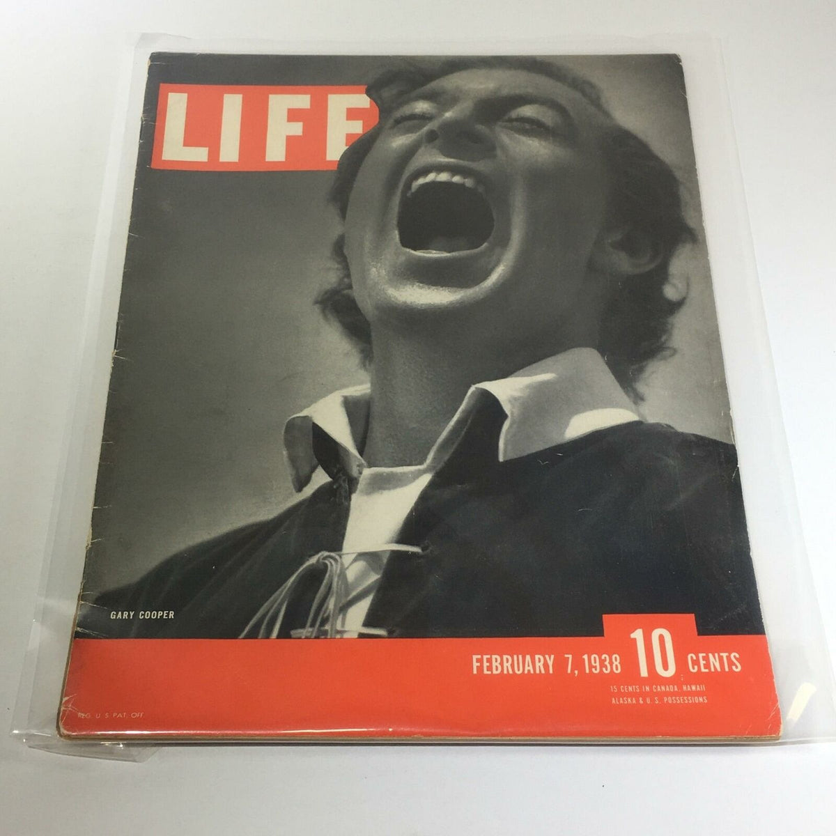 Vintage Life Magazine cover from February 7, 1938, featuring an expressive image of Gary Cooper. This iconic issue captures the essence of 1930s pop culture and aesthetics.
