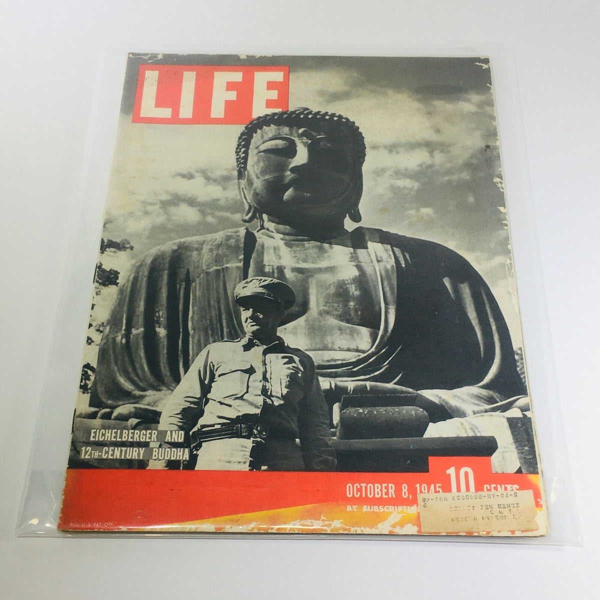 Vintage Life Magazine cover from October 8, 1945, featuring General Eichelberger and a 12th-century Buddha statue, showcasing a moment in history post-World War II.