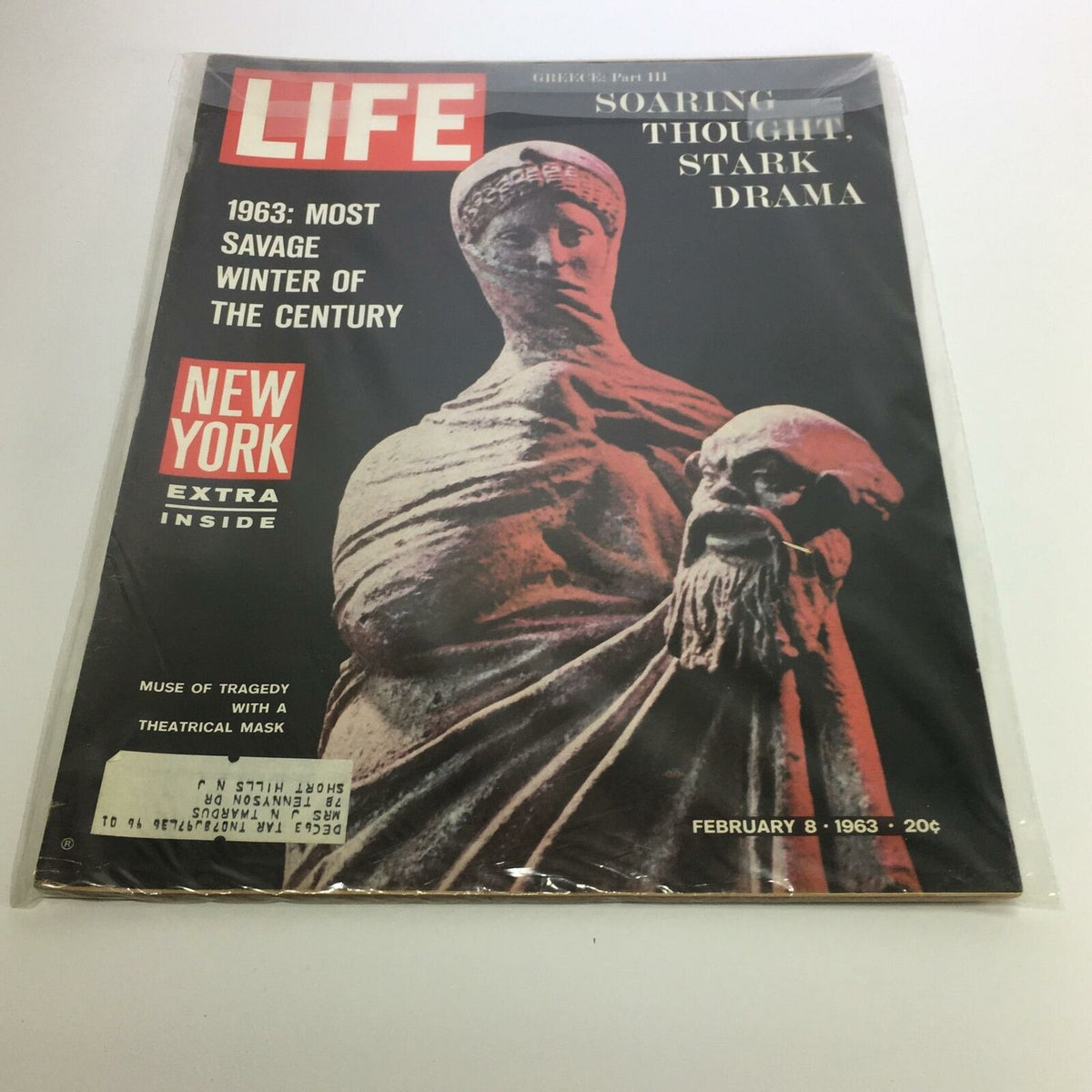 Cover of Life Magazine dated February 8, 1963, featuring the title 'The Muse of Tragedy with a Theatrical Mask'. The magazine highlights the statue depicted in a dramatic illustration, representing a blend of art and history.