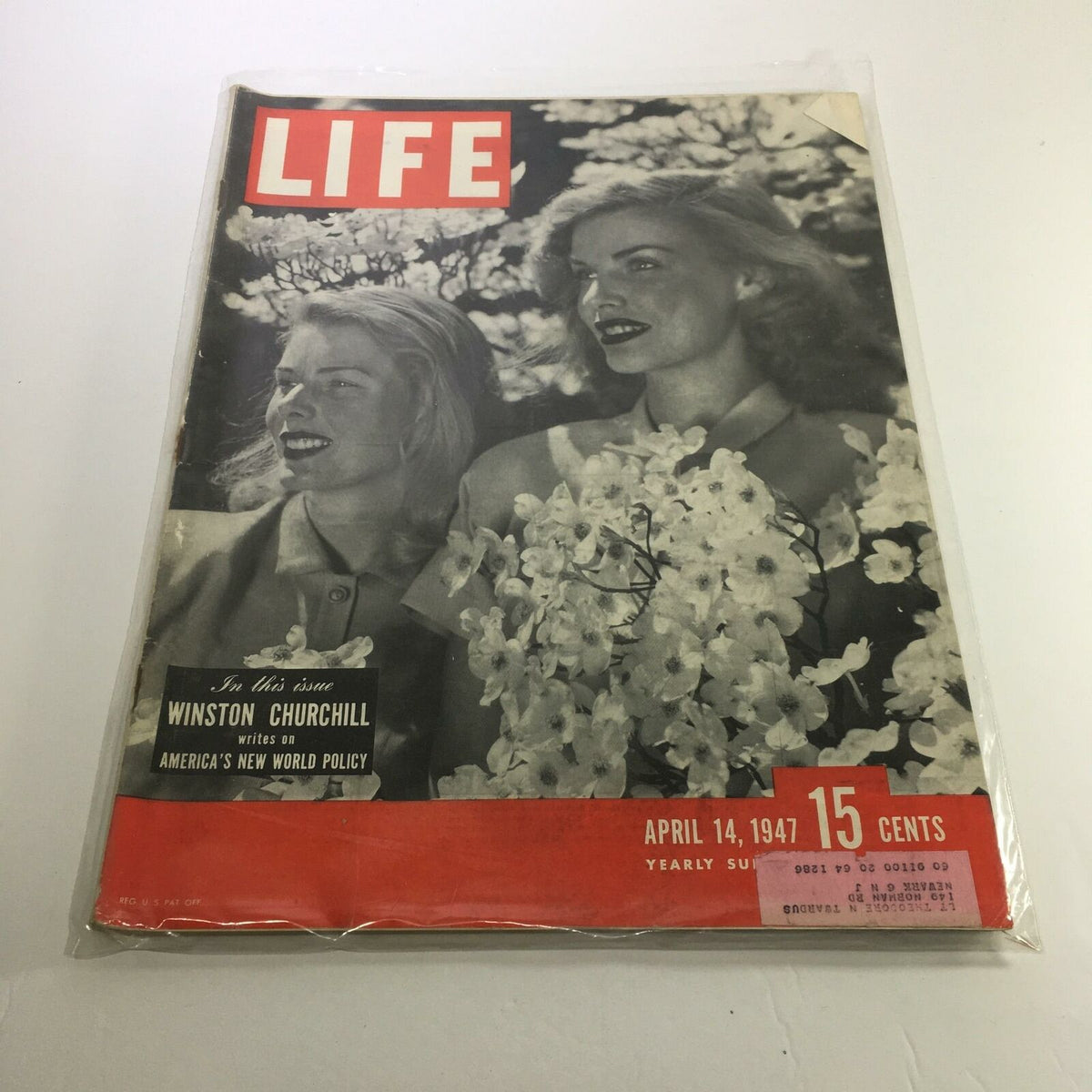 Cover of Life Magazine from April 14, 1947, featuring actress Susan Hayward, showcasing two women surrounded by flowers, priced at 15 cents. An iconic piece of Hollywood history and vintage memorabilia.