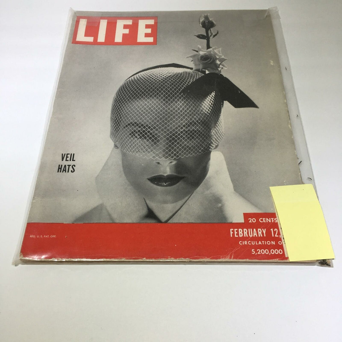 Vintage Life Magazine cover from February 12, 1951, featuring Veil Hats Passion, highlighting a model wearing a veil hat with a netted design, elegant presentation showcasing fashion trends of the early 1950s.