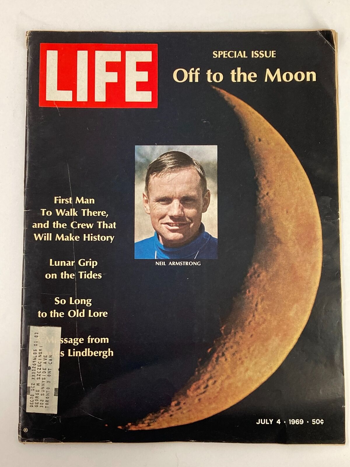 Vintage Life Magazine July 4, 1969 featuring Neil Armstrong, the first man to walk on the moon, with a prominent cover design and celestial backdrop.