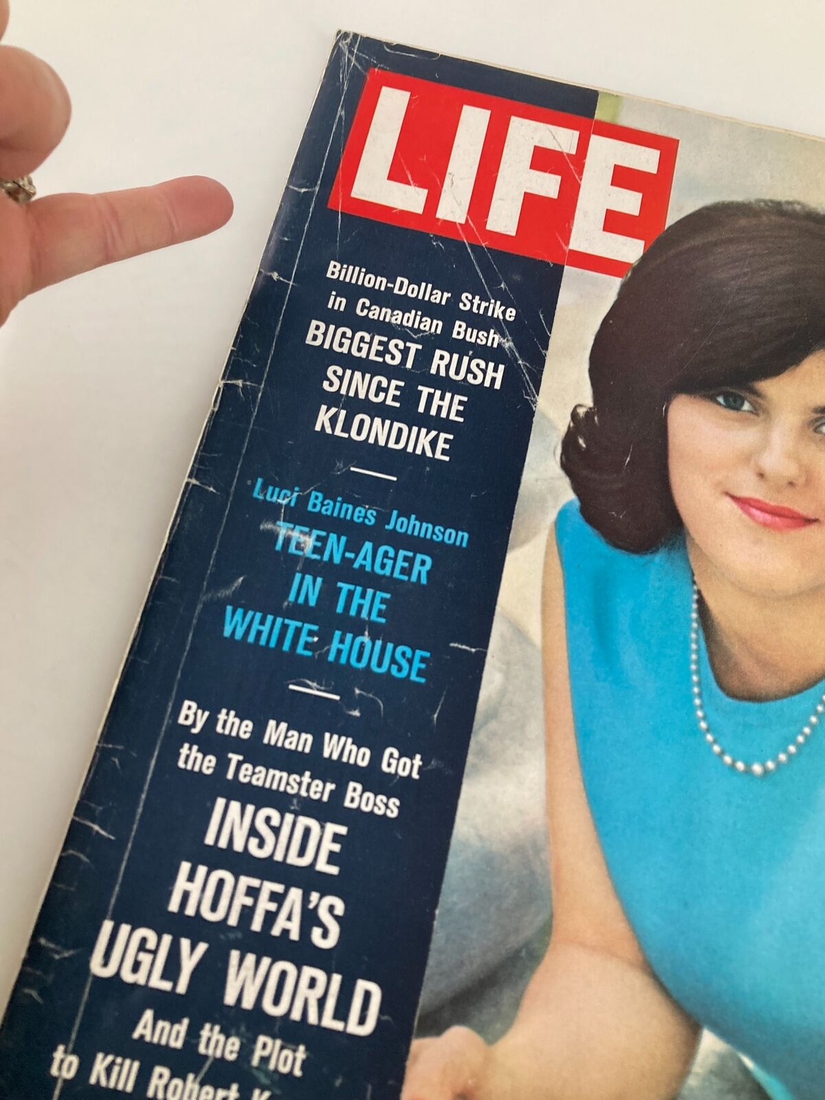 Close-up of the cover of VTG Life Magazine from May 15, 1964 showcasing Luci Baines Johnson, featuring detailed headlines about political and social issues of the 1960s.