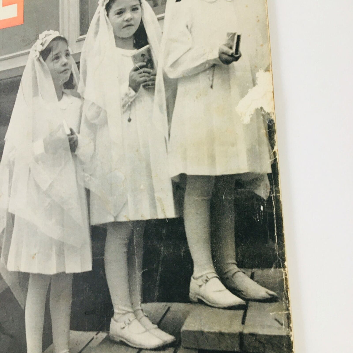 Close-up detail of the front cover of VTG Life Magazine September 2, 1940, highlighting three girls from The Quintuplet's First Communion in white dresses and veils.