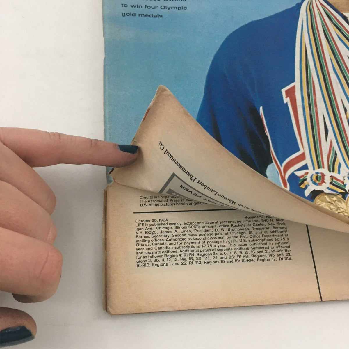 Detail image showing the folded edge of VTG Life Magazine October 30, 1964. The back cover reveals the magazine's publication credits while highlighting Don Schollander's achievements in swimming.