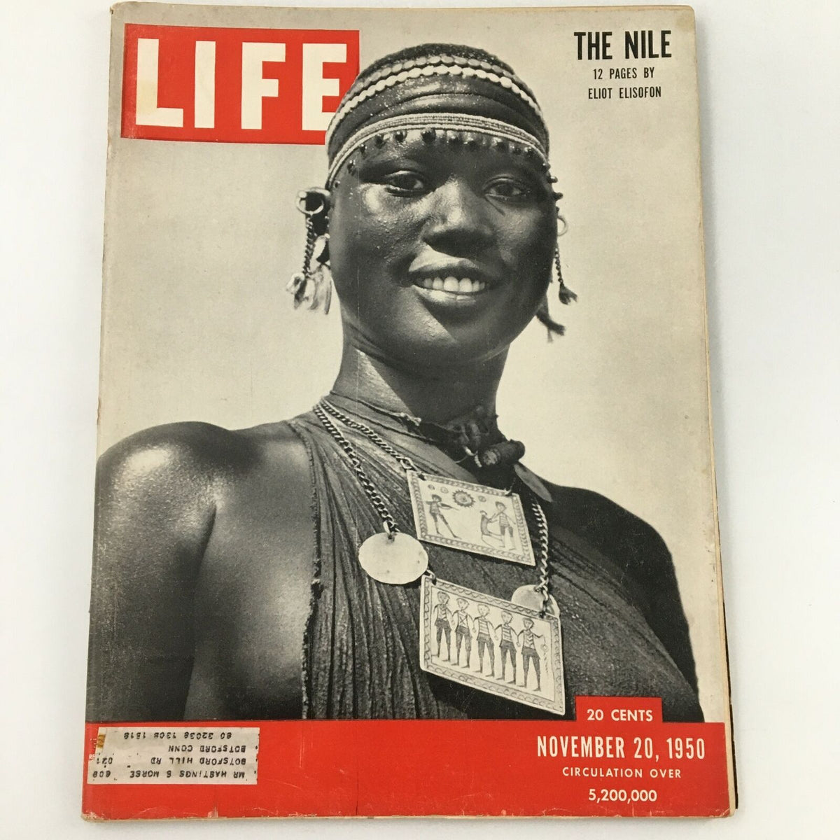 VTG Life Magazine cover from November 20, 1950, featuring a stunning black and white photograph by Eliot Elisofon of a smiling woman adorned with traditional jewelry from the Nile region.
