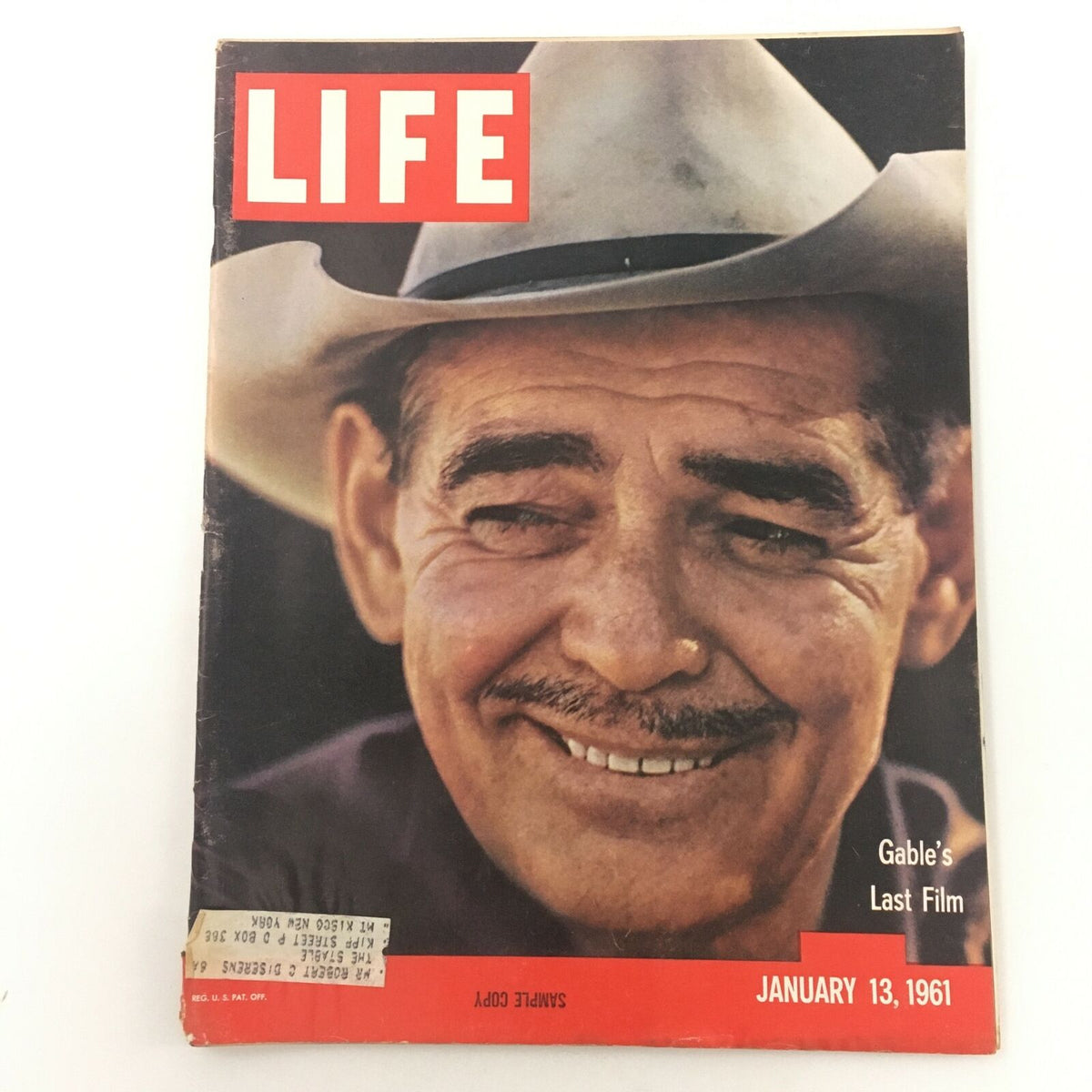 Vintage Life Magazine cover from January 13, 1961 featuring Clark Gable, the King of Hollywood, highlighting his last film. The magazine showcases a warm smile from Gable, adorned with a cowboy hat.