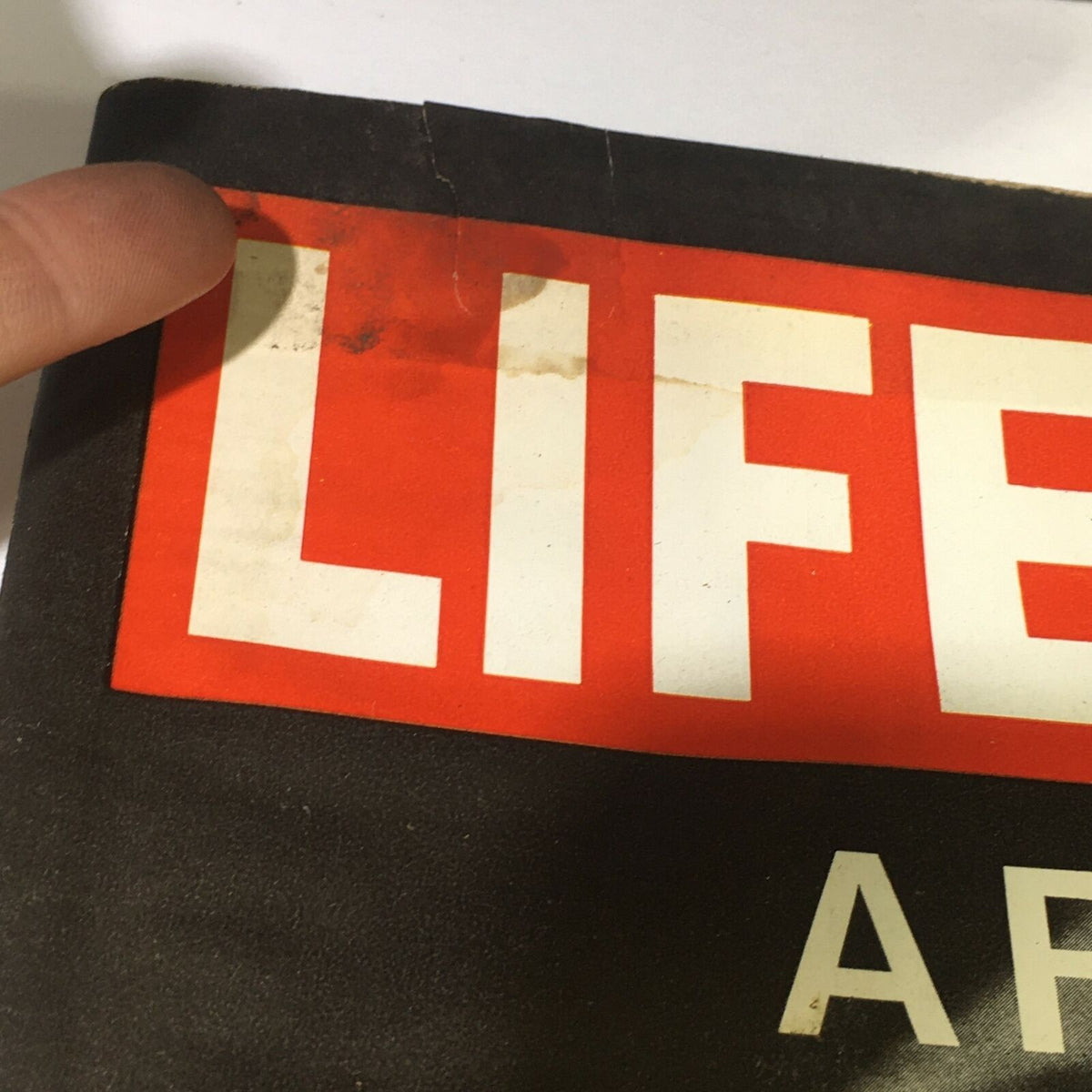 Close-up of the top corner of the May 28, 1971 Life Magazine featuring Chris Brown in The Reverent Rock Opera Jesus, highlighting the title 'LIFE' and signs of minor wear on the magazine's cover.