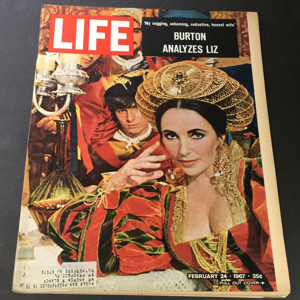 Cover of VTG Life Magazine February 24, 1967 featuring Tim Burton's analysis of Elizabeth Taylor, showcasing vibrant colors and ornate costume details.