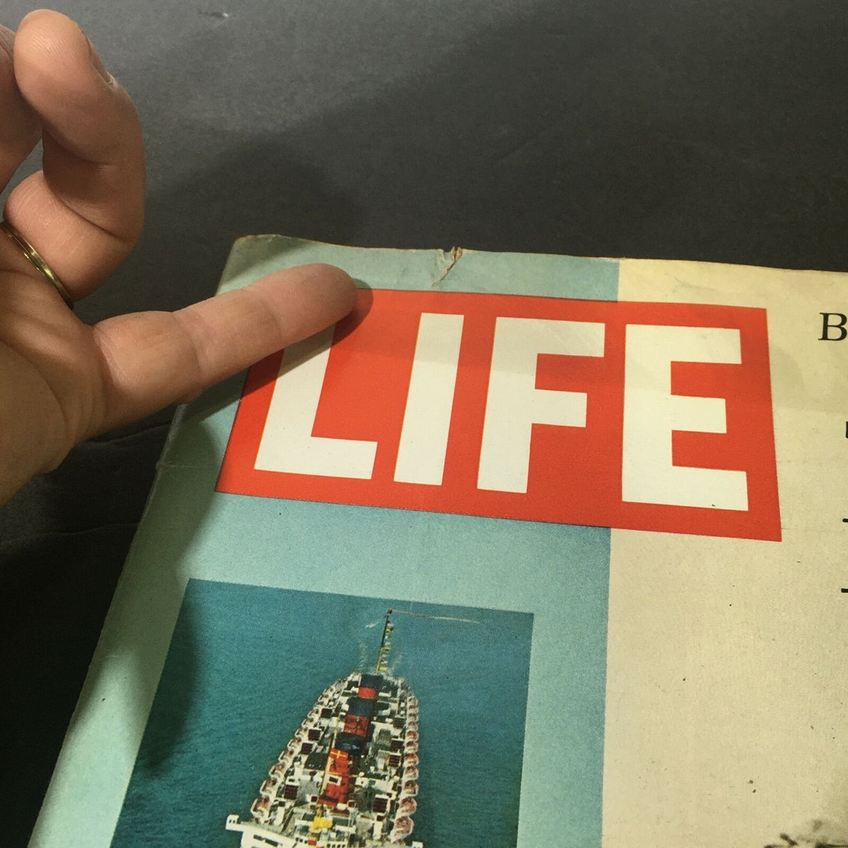Close-up of the cover of VTG Life Magazine October 6 1967, emphasizing the title 'LIFE' and the image of the Queen Mary, highlighting its significance and vintage design.