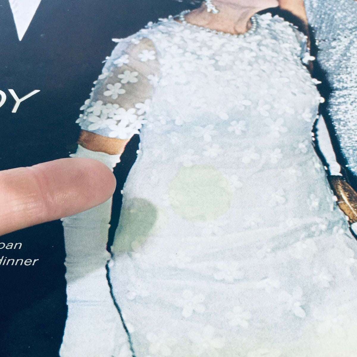 Close-up view of a vintage Life Magazine cover featuring Rose Kennedy at 80 celebrating with Ted and Joan, showcasing the delicate floral patterns of her dress.